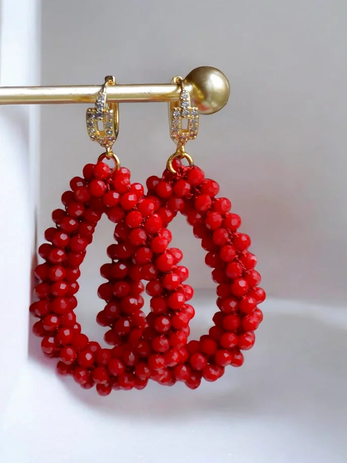 Les boucles d'oreilles rouges Nina