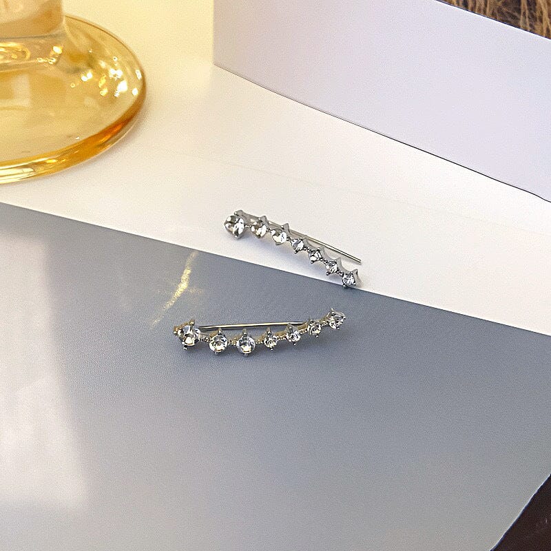 Örhänge med sju stjärnor och diamanter